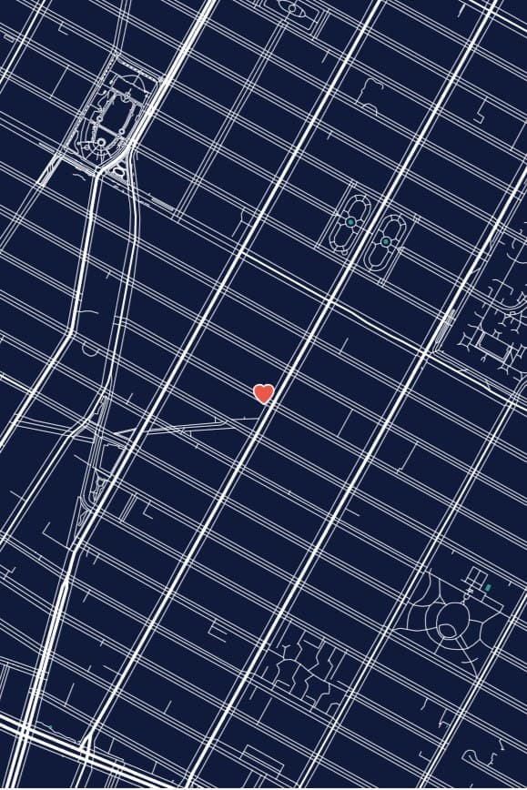 The East Village street grid in New York drawn in white on navy, with a small red heart.