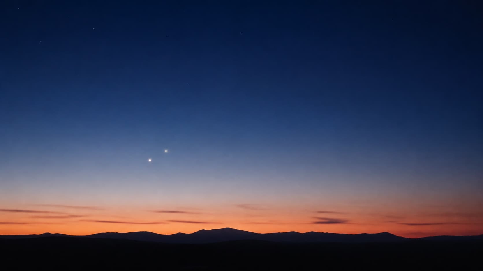 Two bright planets visible during evening twilight just above the horizon